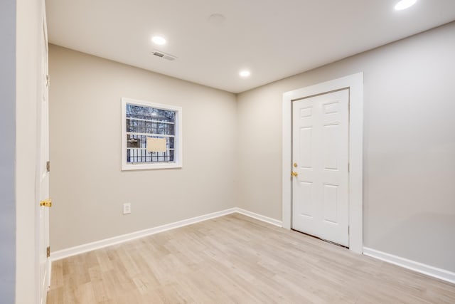 unfurnished room featuring light wood-type flooring