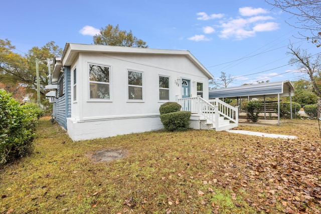 view of front of home featuring a carport