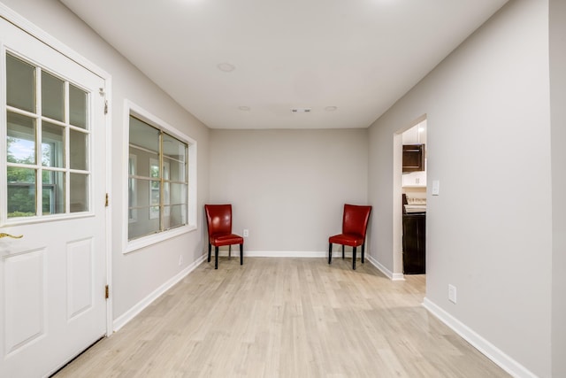 sitting room featuring light hardwood / wood-style flooring