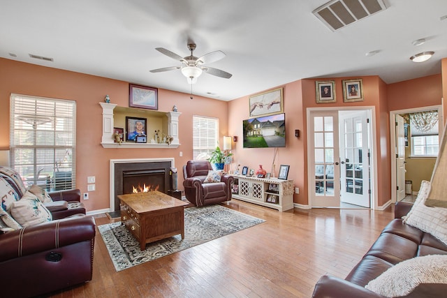 2017 Asher Loop, Summerville, SC 29485 - living area featuring a ceiling fan, a warm lit fireplace, wood-type flooring, and baseboards