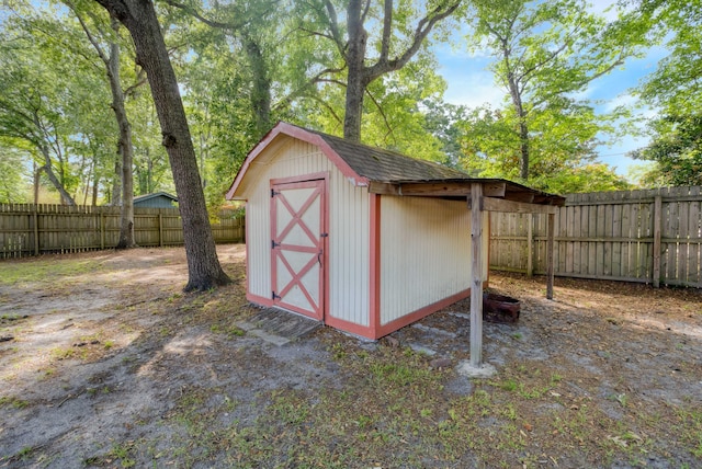view of shed featuring a fenced backyard