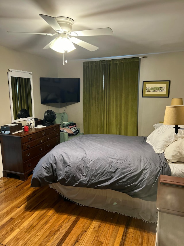 bedroom featuring ceiling fan and light hardwood / wood-style floors