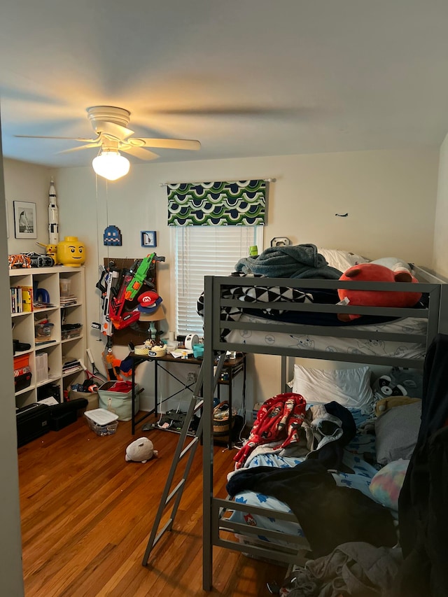 bedroom featuring ceiling fan and wood-type flooring