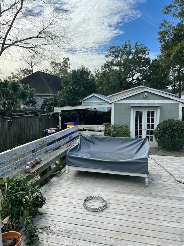 wooden deck featuring french doors