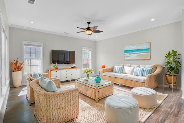 living area with recessed lighting, wood finished floors, ornamental molding, and a ceiling fan