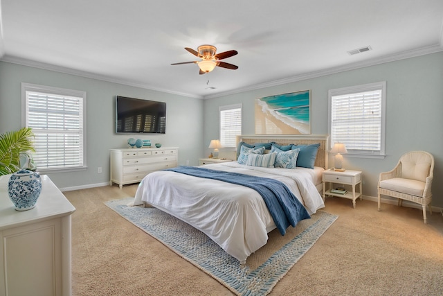 bedroom featuring a ceiling fan, baseboards, visible vents, and ornamental molding