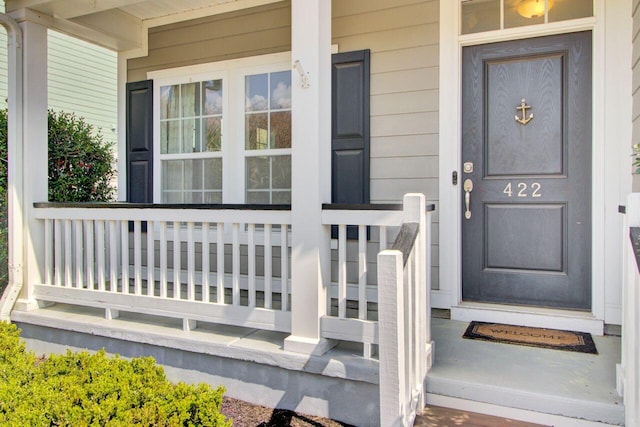 doorway to property featuring a porch