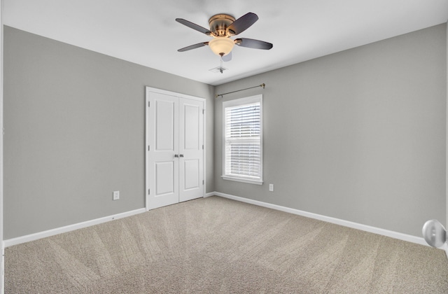 interior space featuring a ceiling fan and baseboards