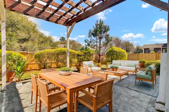 view of patio with outdoor dining area, a fenced backyard, a pergola, and an outdoor hangout area