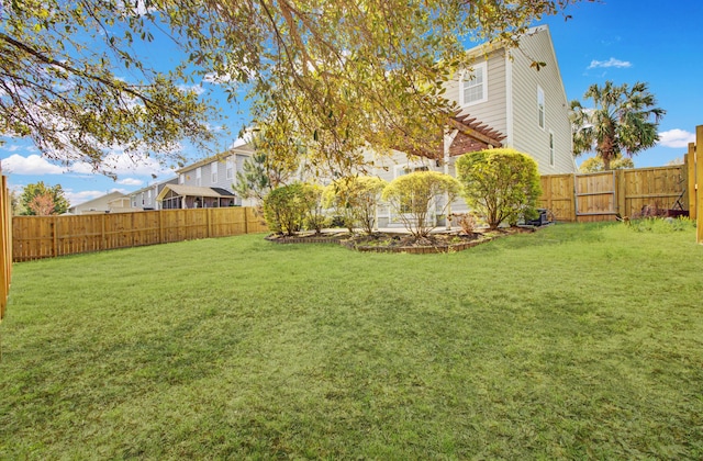 view of yard featuring a fenced backyard and a pergola