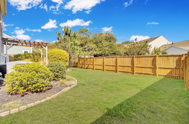 view of yard with a fenced backyard and a pergola