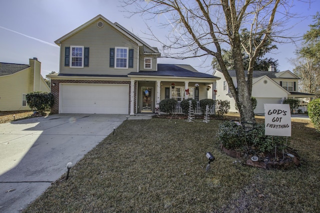 front facade featuring a front yard, a porch, and a garage