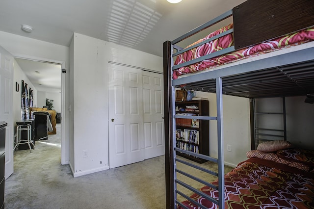 carpeted bedroom with a closet