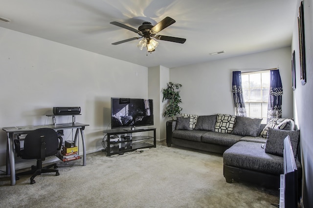 living room featuring carpet and ceiling fan