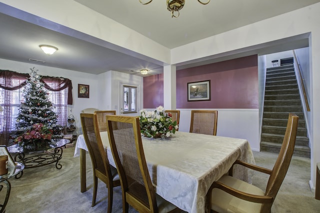 carpeted dining space featuring a wealth of natural light