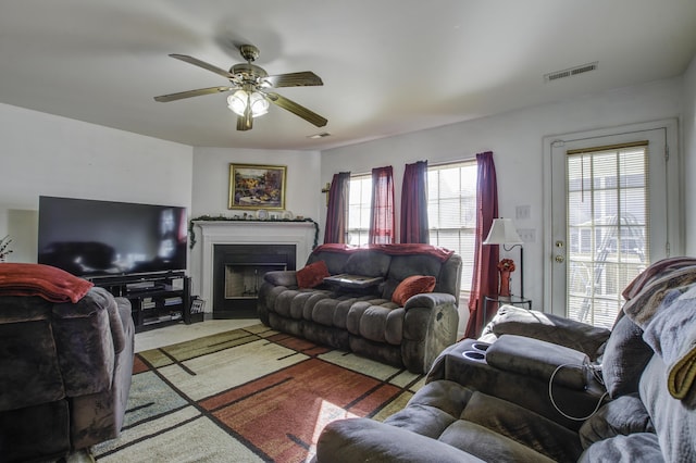 living room with ceiling fan and carpet floors