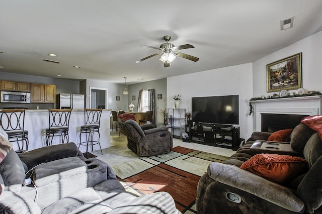 living room with ceiling fan