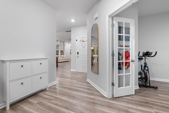 hallway with light wood-type flooring