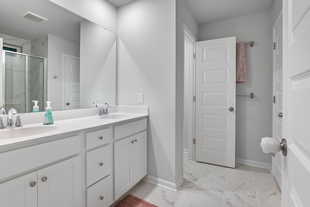 bathroom with an enclosed shower and vanity