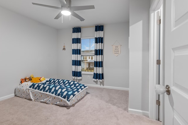 bedroom featuring ceiling fan and light carpet