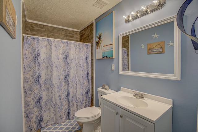 bathroom featuring visible vents, vanity, toilet, a shower with shower curtain, and a textured ceiling