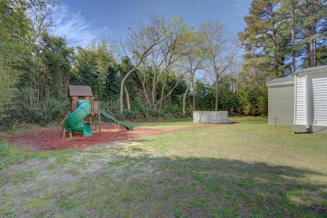 view of yard with a playground