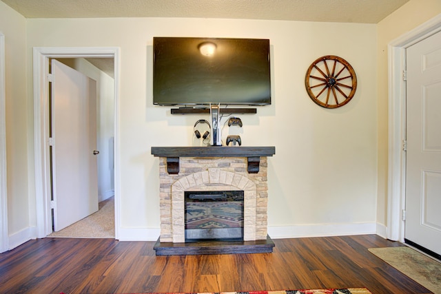 unfurnished living room featuring baseboards and wood finished floors