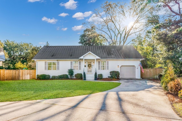 ranch-style home with a garage, driveway, a front yard, and fence