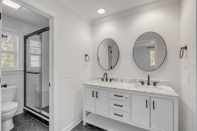 bathroom featuring ornamental molding, tile patterned flooring, a sink, and toilet