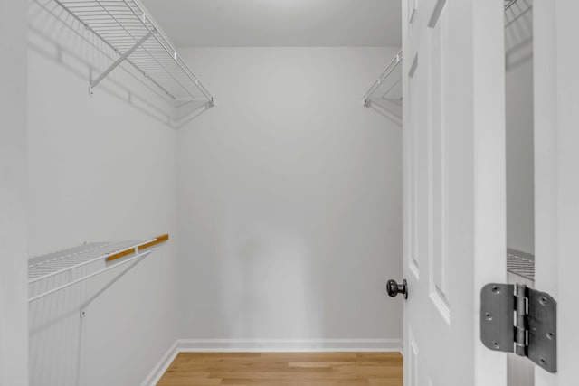 spacious closet with wood finished floors