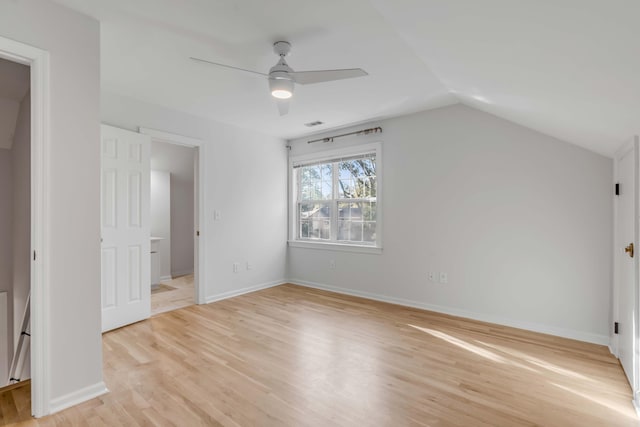 bonus room featuring lofted ceiling, light wood finished floors, ceiling fan, and baseboards