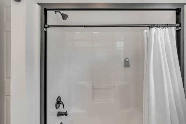 full bathroom featuring shower / tub combo with curtain