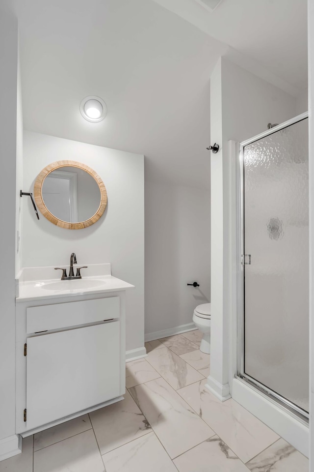 full bathroom featuring toilet, marble finish floor, a shower stall, and vanity