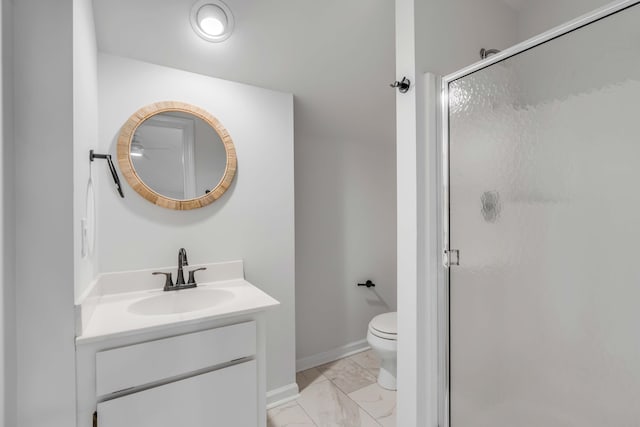 bathroom with marble finish floor, toilet, a stall shower, vanity, and baseboards