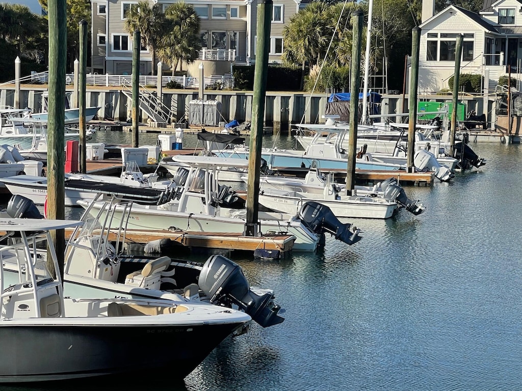 exercise room featuring a water view