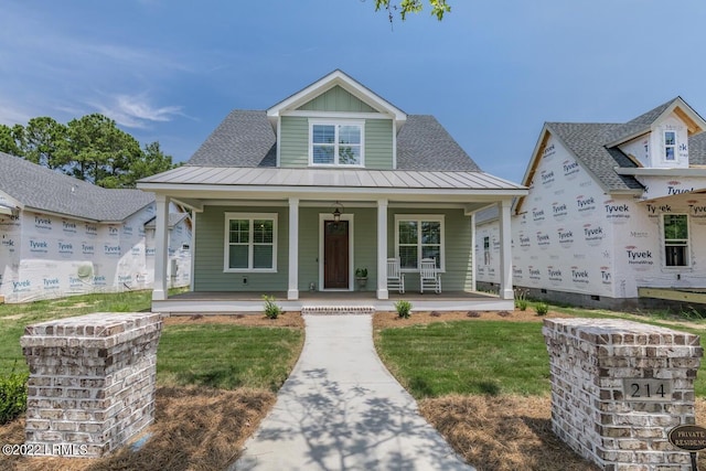 view of front of property featuring covered porch