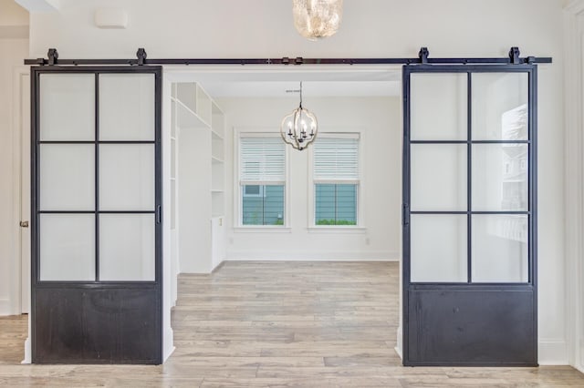 1485 Bourne Xing, Mount Pleasant, SC 29466 - unfurnished dining area featuring a chandelier and wood finished floors
