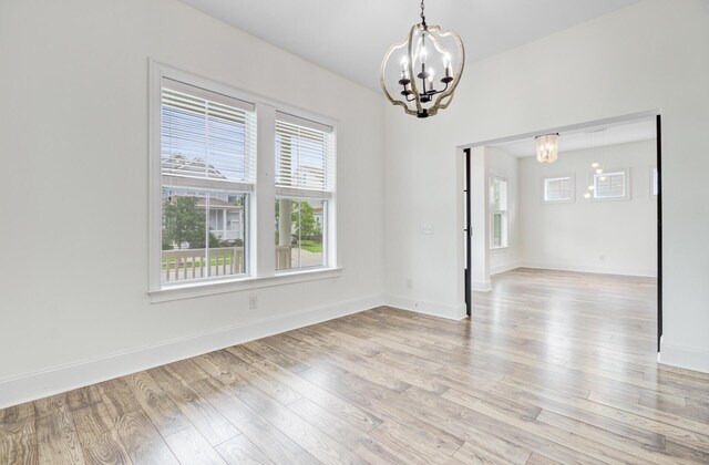 1485 Bourne Xing, Mount Pleasant, SC 29466 - empty room with a chandelier, plenty of natural light, and light wood-type flooring