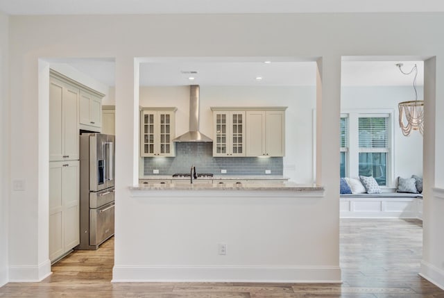 1485 Bourne Xing, Mount Pleasant, SC 29466 - kitchen with wall chimney exhaust hood, stainless steel fridge with ice dispenser, backsplash, light wood-type flooring, and recessed lighting