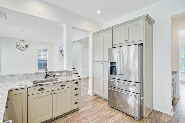 1485 Bourne Xing, Mount Pleasant, SC 29466 - kitchen featuring high quality fridge, light wood-type flooring, light stone counters, a chandelier, and recessed lighting