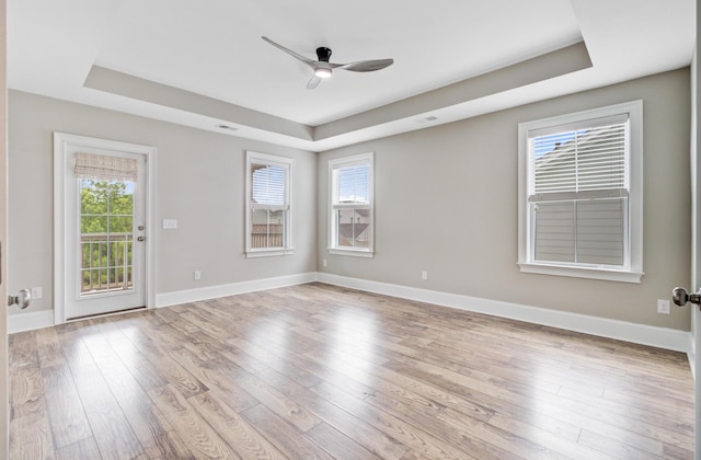 1485 Bourne Xing, Mount Pleasant, SC 29466 - unfurnished room featuring a tray ceiling, a ceiling fan, and light wood finished floors