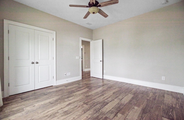 1485 Bourne Xing, Mount Pleasant, SC 29466 - unfurnished bedroom with wood finished floors, a closet, and ceiling fan