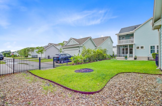 1485 Bourne Xing, Mount Pleasant, SC 29466 - view of yard featuring a ceiling fan, a residential view, a balcony, driveway, and an attached garage