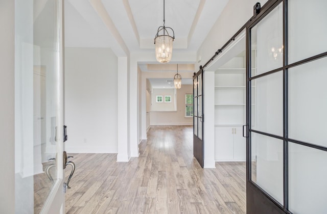 1485 Bourne Xing, Mount Pleasant, SC 29466 - entryway with a barn door, light wood-type flooring, french doors, and a chandelier