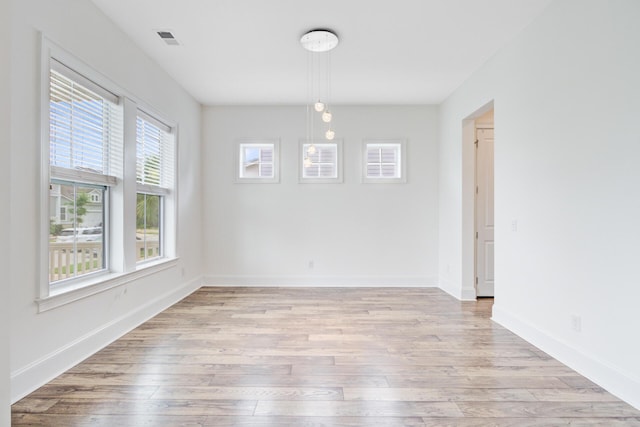 1485 Bourne Xing, Mount Pleasant, SC 29466 - unfurnished dining area with light wood-style flooring and baseboards