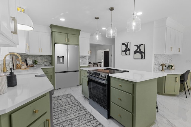 3385 Wayland Dr, Ladson, SC 29456 - kitchen with green cabinetry, appliances with stainless steel finishes, a center island, decorative backsplash, and white cabinets