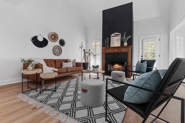 3385 Wayland Dr, Ladson, SC 29456 - living area featuring a warm lit fireplace, high vaulted ceiling, and wood finished floors