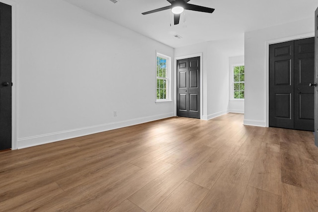 3385 Wayland Dr, Ladson, SC 29456 - unfurnished bedroom with light wood-style floors, multiple windows, and ceiling fan