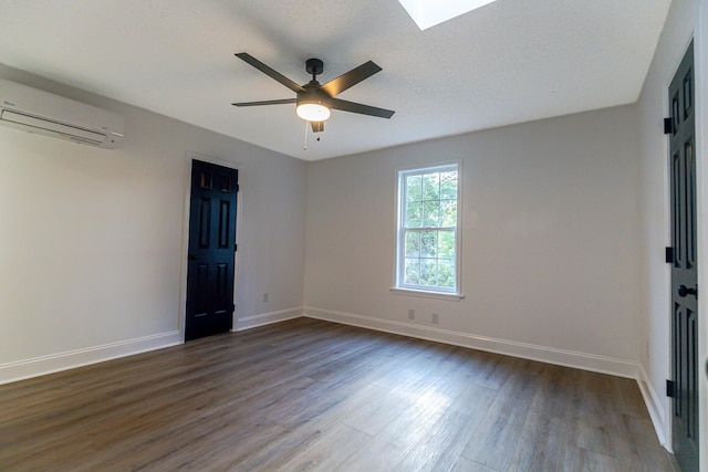 3385 Wayland Dr, Ladson, SC 29456 - unfurnished room featuring a wall mounted AC, dark wood finished floors, a ceiling fan, and a skylight