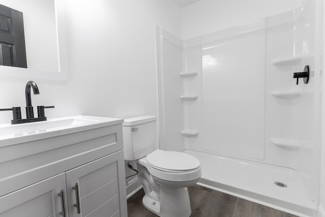 3385 Wayland Dr, Ladson, SC 29456 - full bath featuring wood finished floors, vanity, and a shower